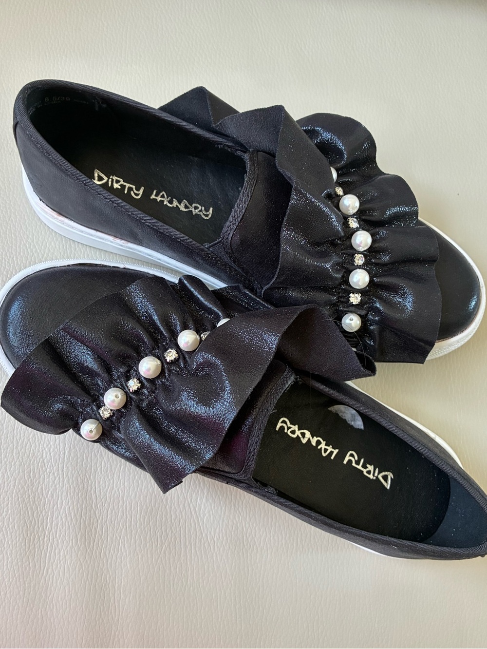 Black sneakers by Dirty Laundry